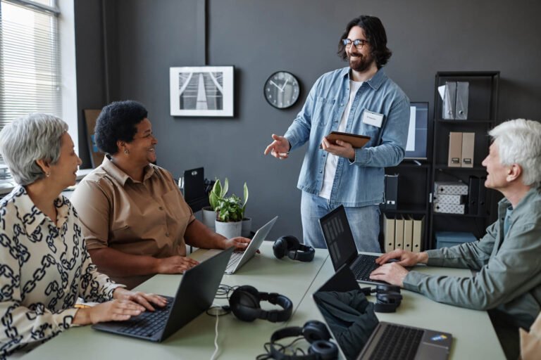 Bearded Young Man Leading Computer Class For Senio 2023 11 27 05 30 10 Utc 2 1 768x512